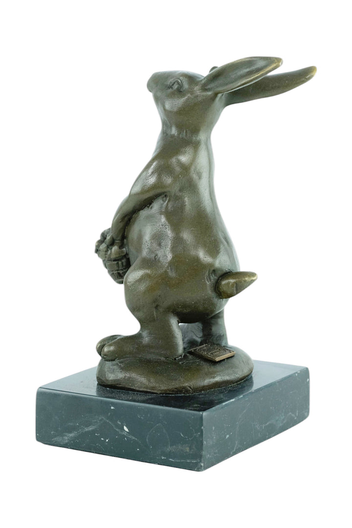 Bronze sculpture of a bunny with a flower basket