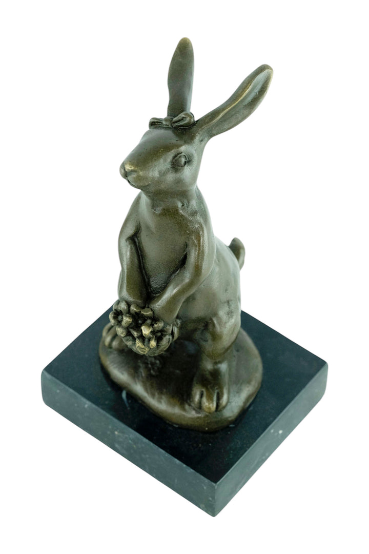 Bronze sculpture of a bunny with a flower basket