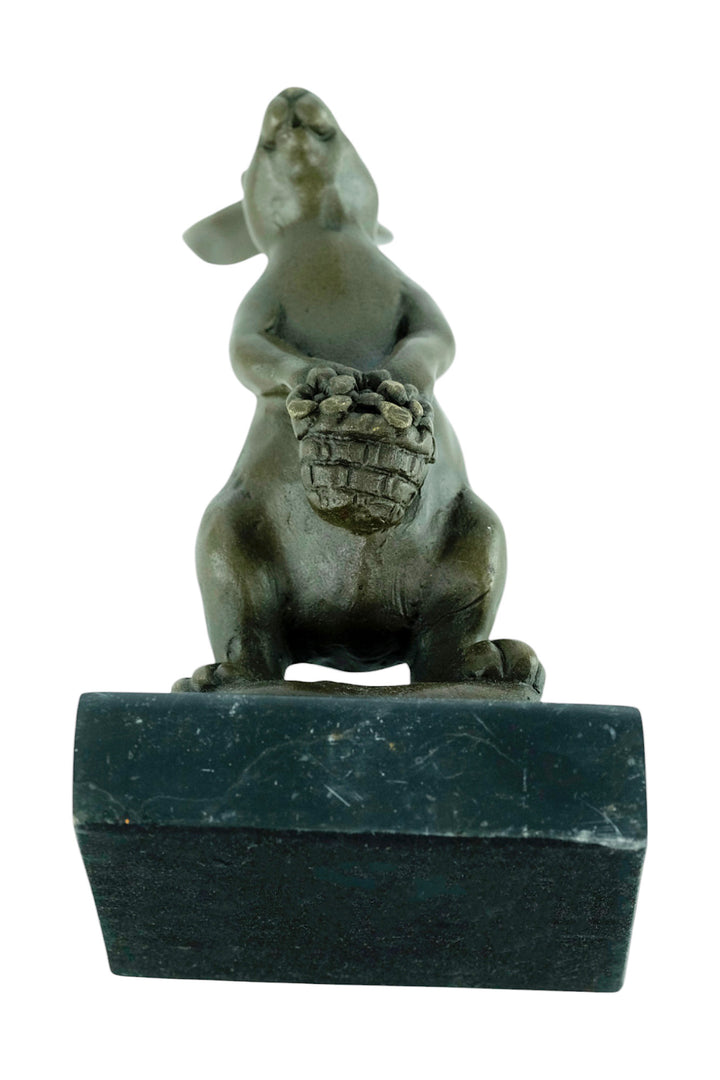Bronze sculpture of a bunny with a flower basket
