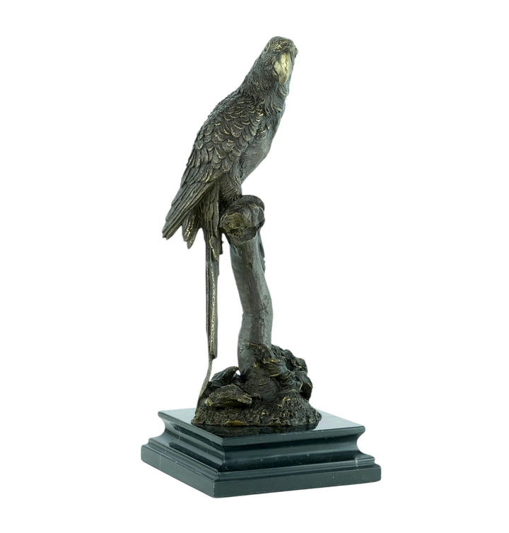 Bronze sculpture of a parrot sitting on a branch