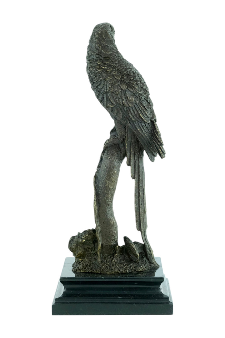 Bronze sculpture of a parrot sitting on a branch