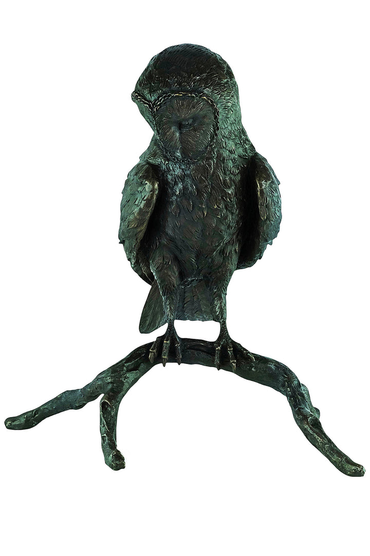 Large bronze sculpture of an owl sitting on a branch