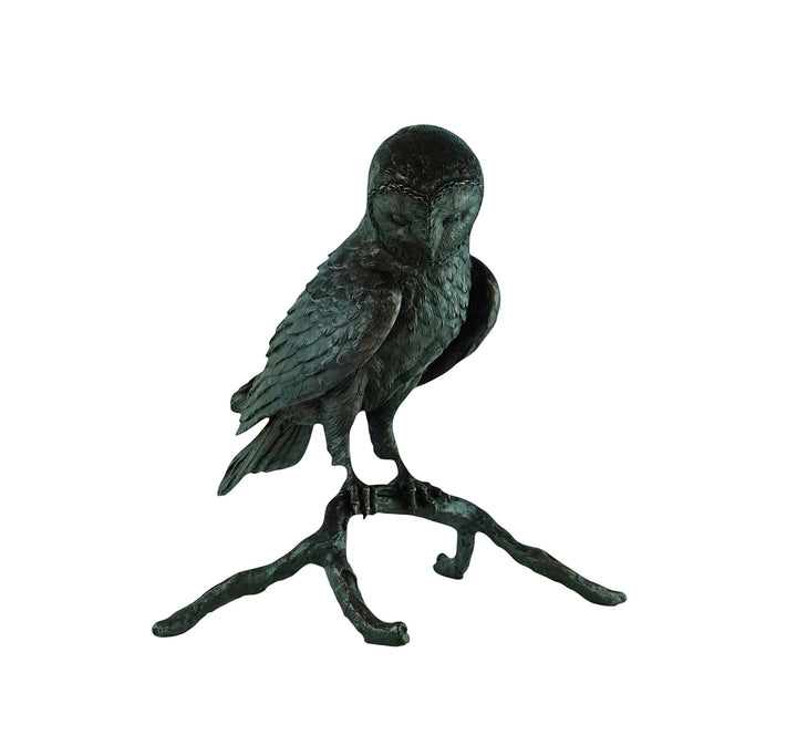Large bronze sculpture of an owl sitting on a branch