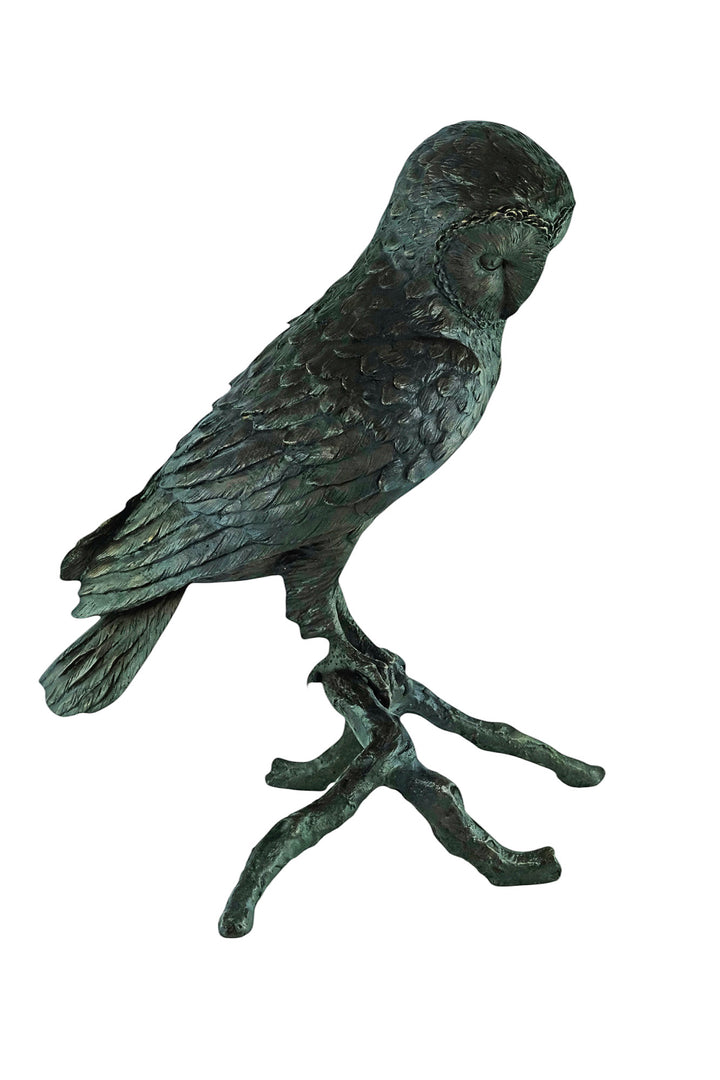 Large bronze sculpture of an owl sitting on a branch