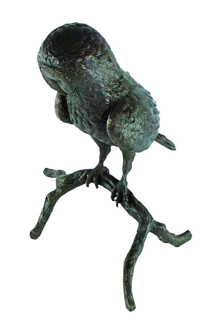 Large bronze sculpture of an owl sitting on a branch