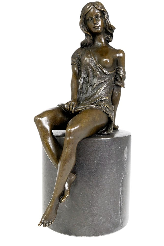 Bronze sculpture of a sitting female in flimsy dress