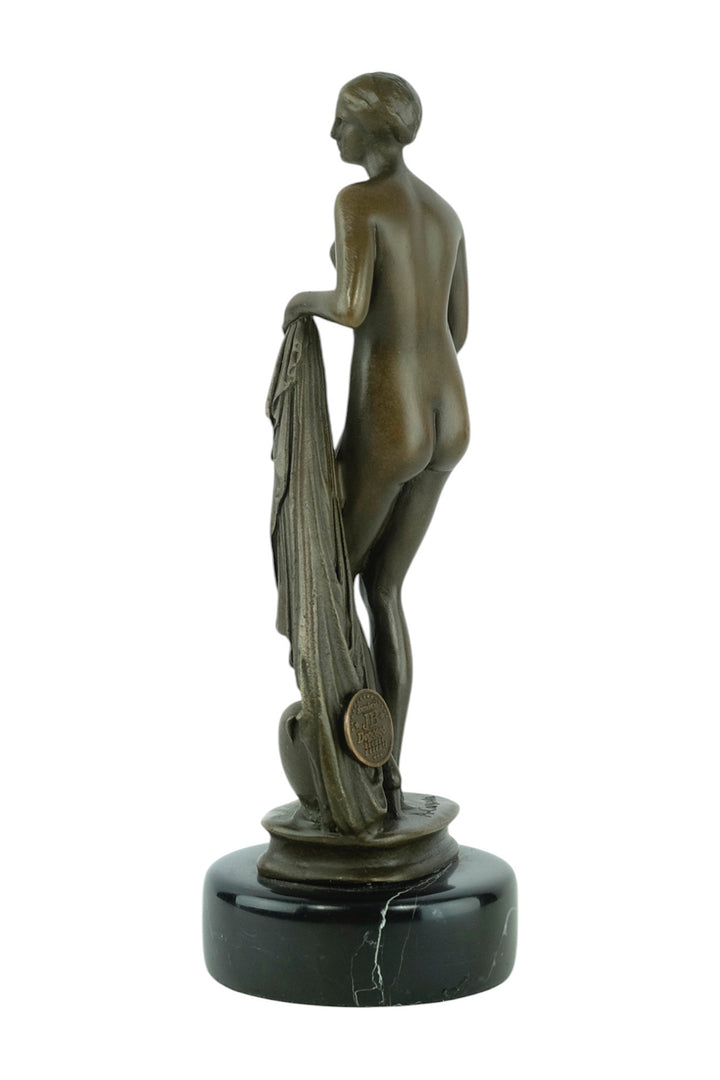Bronze sculpture of a bathing female