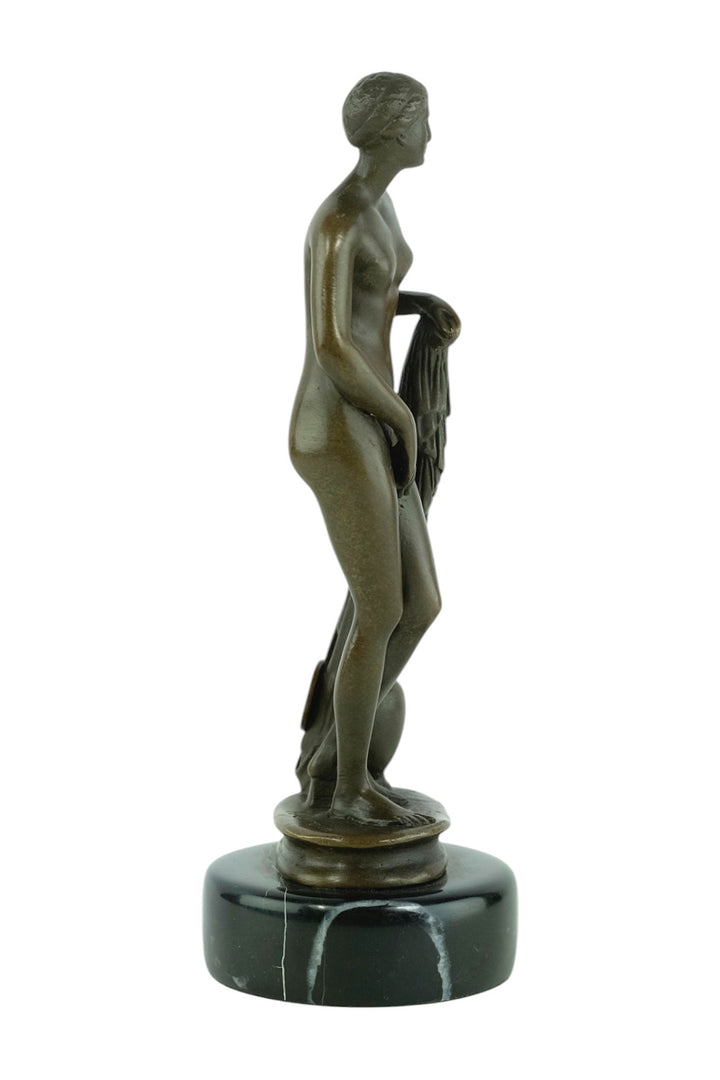 Bronze sculpture of a bathing female