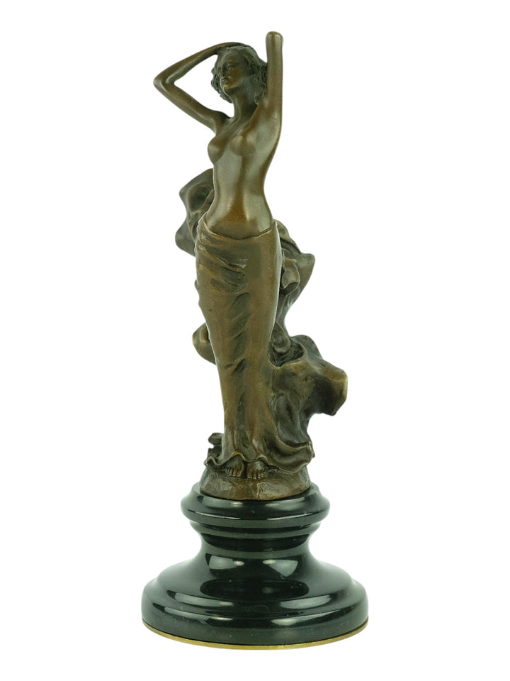 Bronze sculpture of a female in a swirling dress