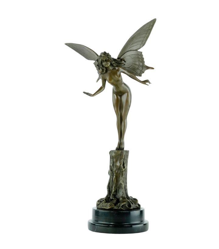Bronze sculpture of a winged fairy standing on a tree trunk