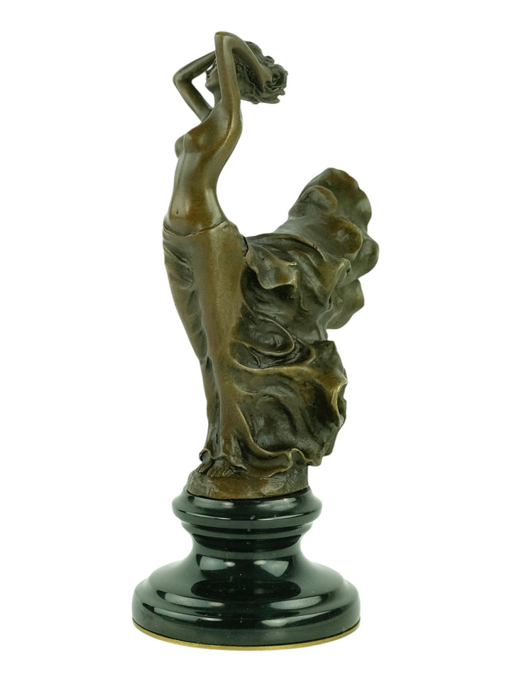 Bronze sculpture of a female in a swirling dress