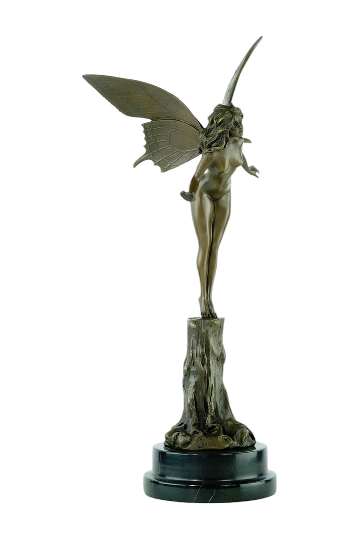 Bronze sculpture of a winged fairy standing on a tree trunk