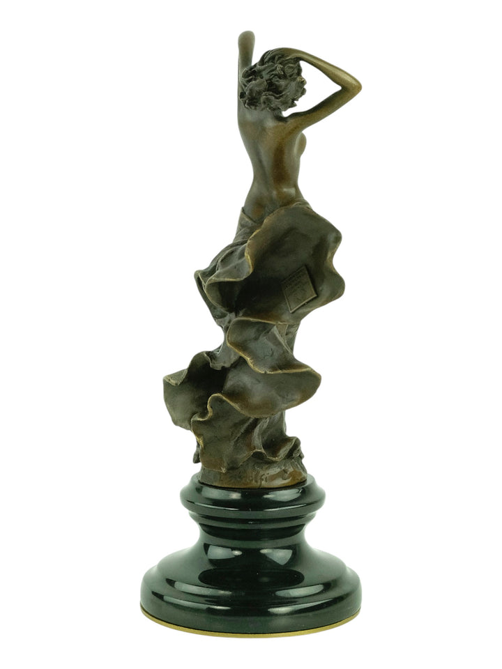 Bronze sculpture of a female in a swirling dress