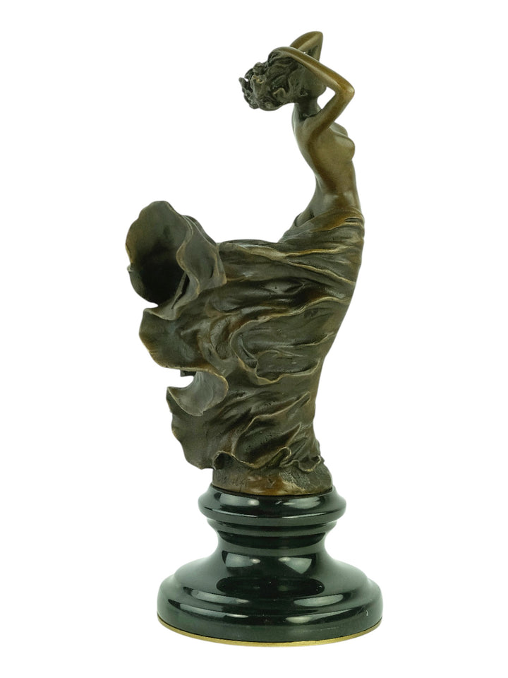 Bronze sculpture of a female in a swirling dress