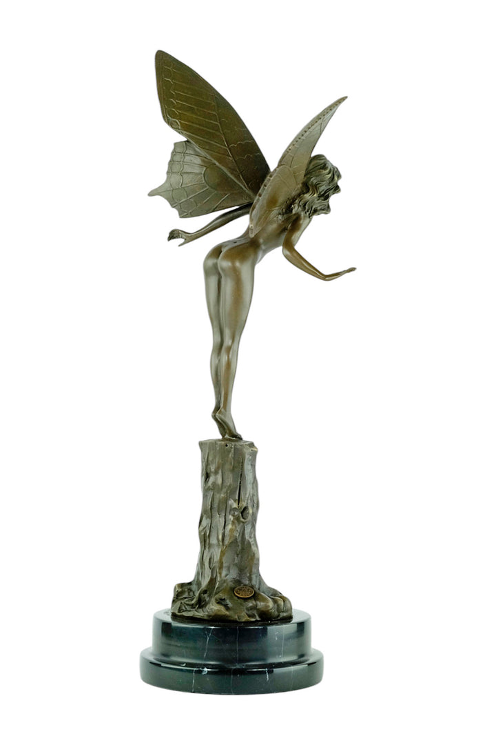Bronze sculpture of a winged fairy standing on a tree trunk
