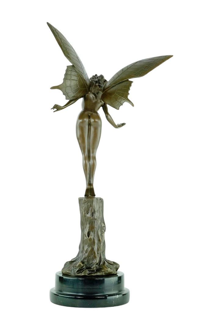 Bronze sculpture of a winged fairy standing on a tree trunk