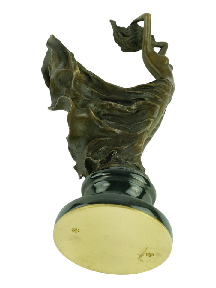Bronze sculpture of a female in a swirling dress