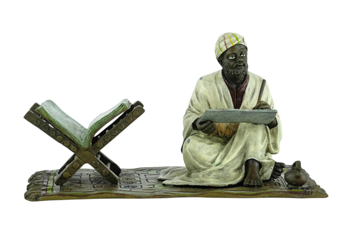 Bronze sculpture of a Quran scribe