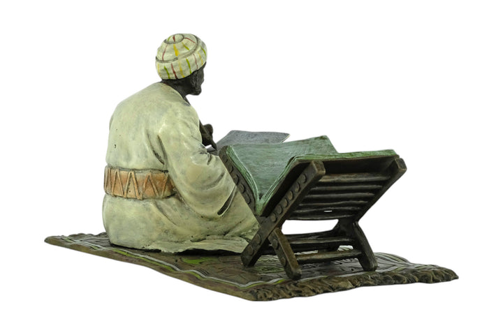 Bronze sculpture of a Quran scribe