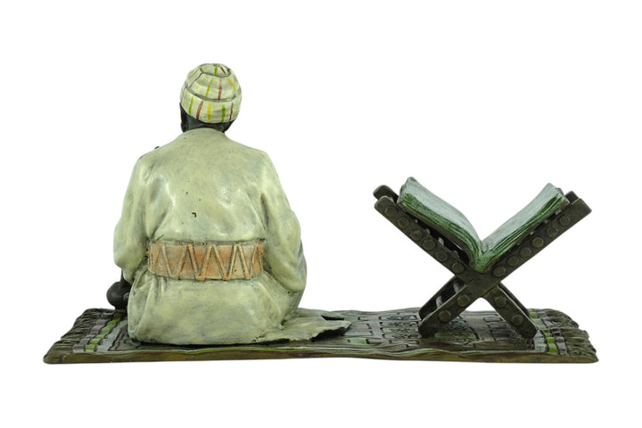 Bronze sculpture of a Quran scribe