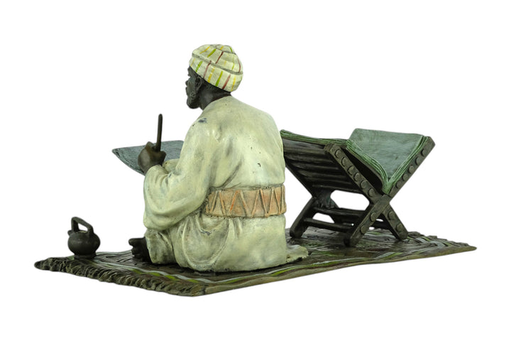 Bronze sculpture of a Quran scribe