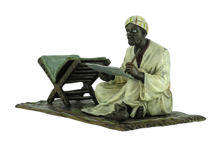 Bronze sculpture of a Quran scribe