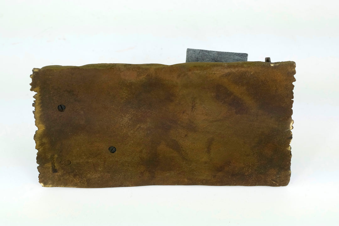 Bronze sculpture of a Quran scribe