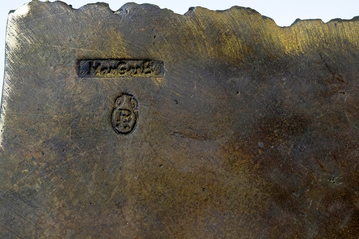 Bronze sculpture of a Quran scribe
