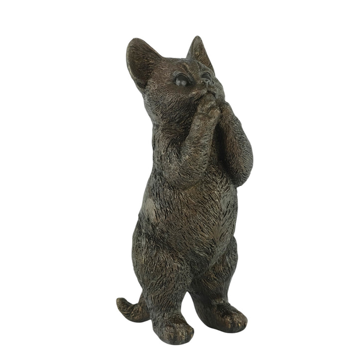 Bronze sculpture of a standing kitten