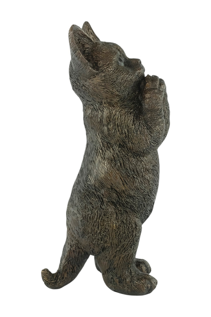 Bronze sculpture of a standing kitten