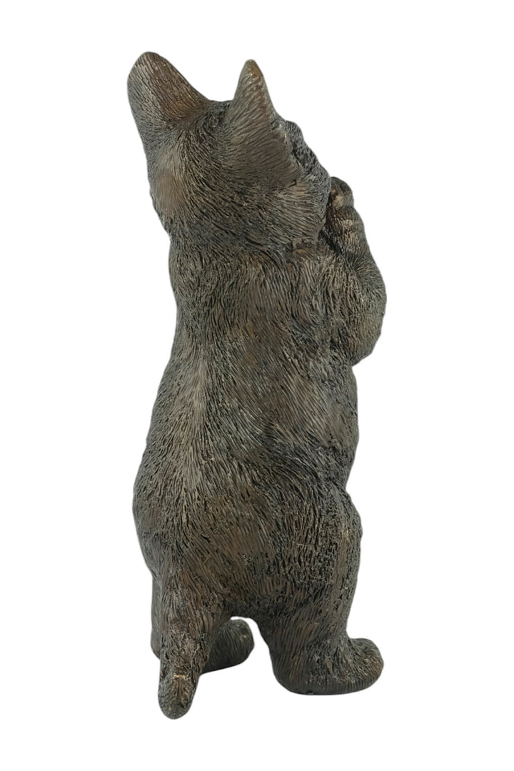 Bronze sculpture of a standing kitten