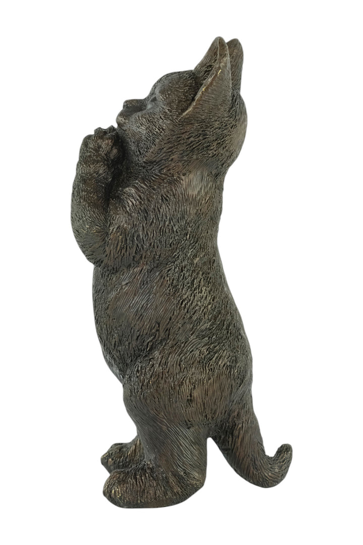 Bronze sculpture of a standing kitten