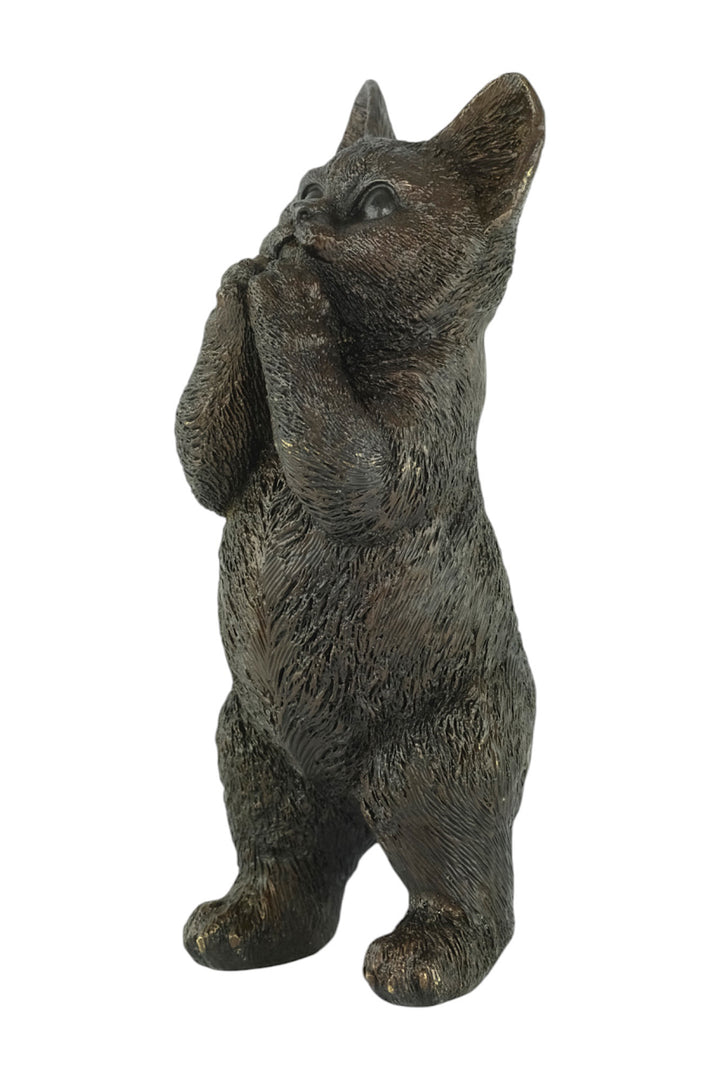 Bronze sculpture of a standing kitten