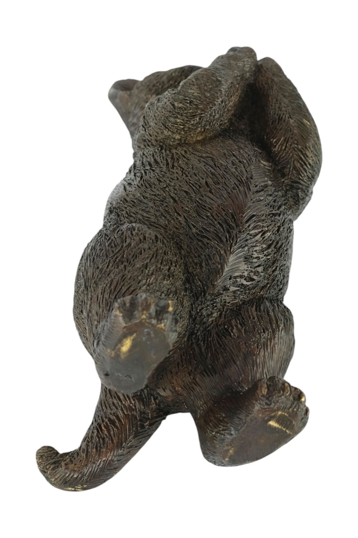 Bronze sculpture of a standing kitten