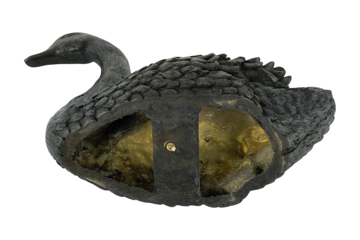 Bronze sculpture of a swimming swan