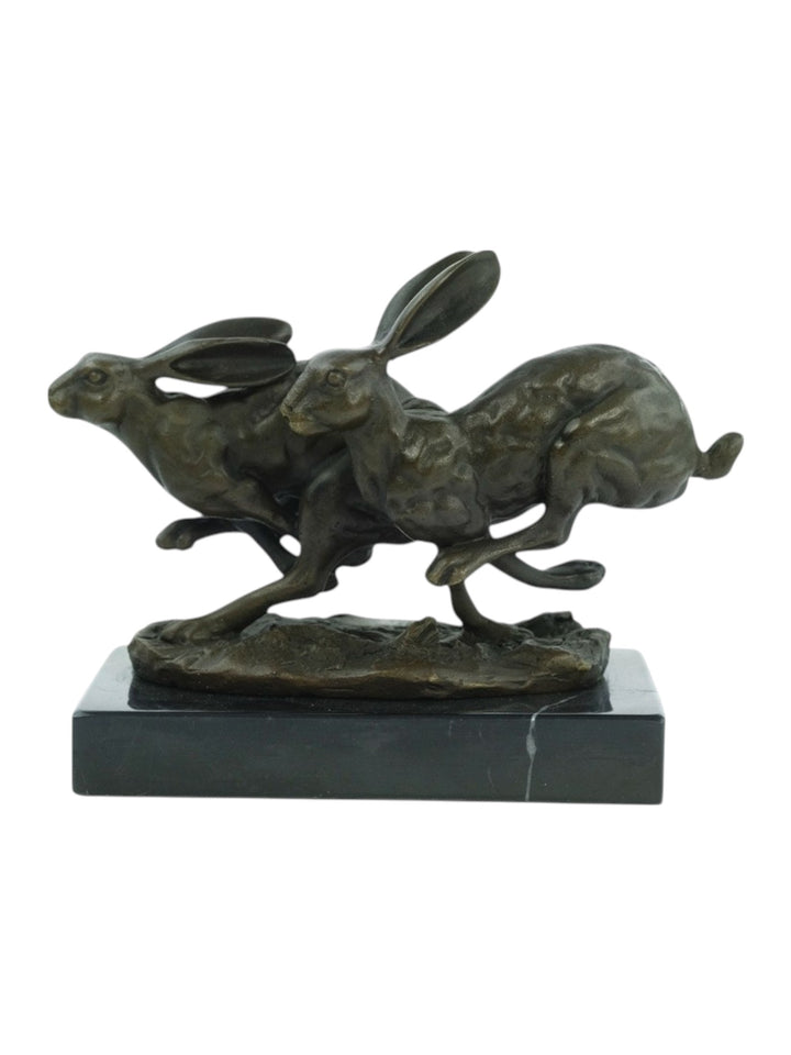 Bronzen sculptuur van rennende hazen