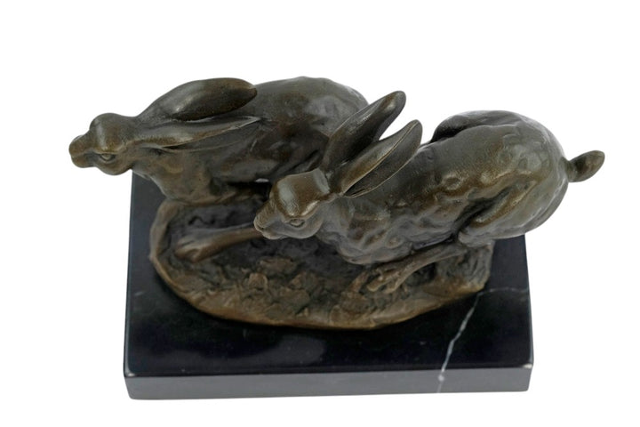 Bronze running hares sculpture