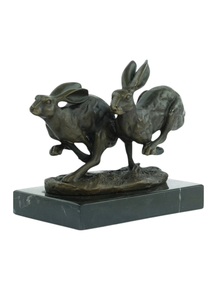 Bronzen sculptuur van rennende hazen