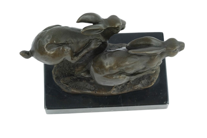 Bronze running hares sculpture