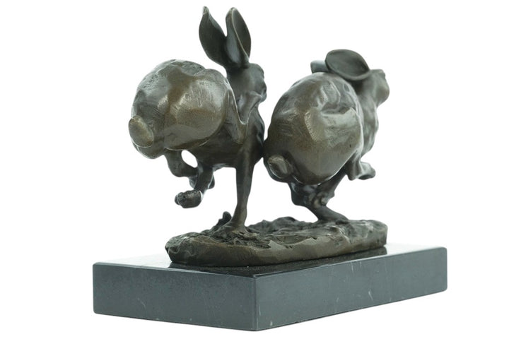 Bronze running hares sculpture