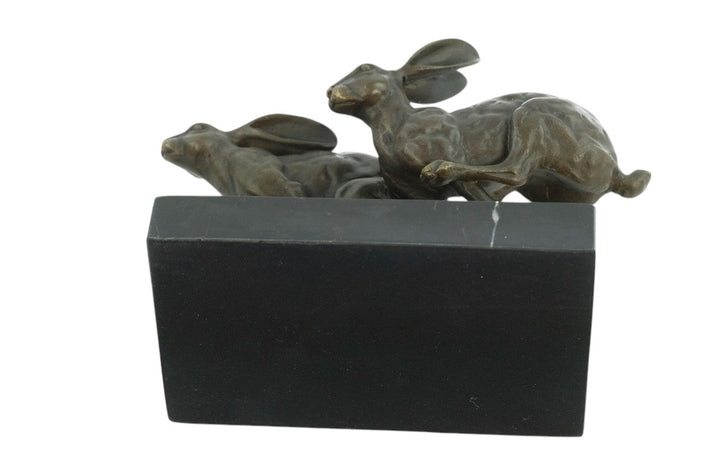 Bronze running hares sculpture