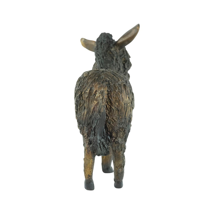 Bronze sculpture of a standing donkey blinded by it's coat hair