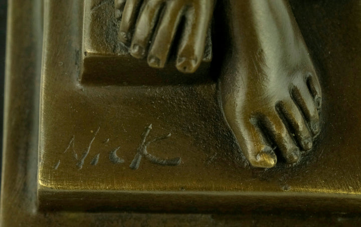 Bronze sculpture of a standing female nude