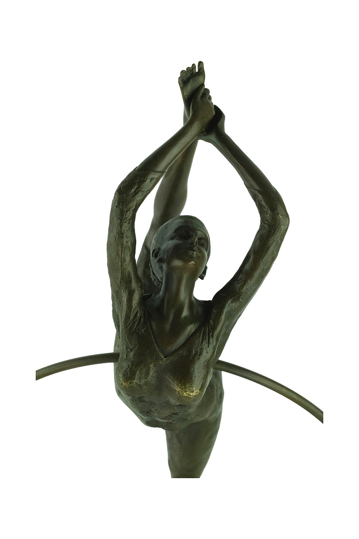 Bronze sculpture of a flexible hoop dancer
