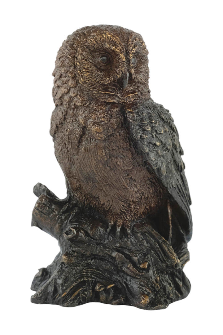 Bronze sculpture of a small own on a tree trunk