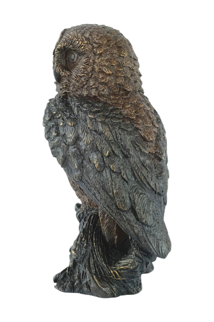 Bronze sculpture of a small own on a tree trunk
