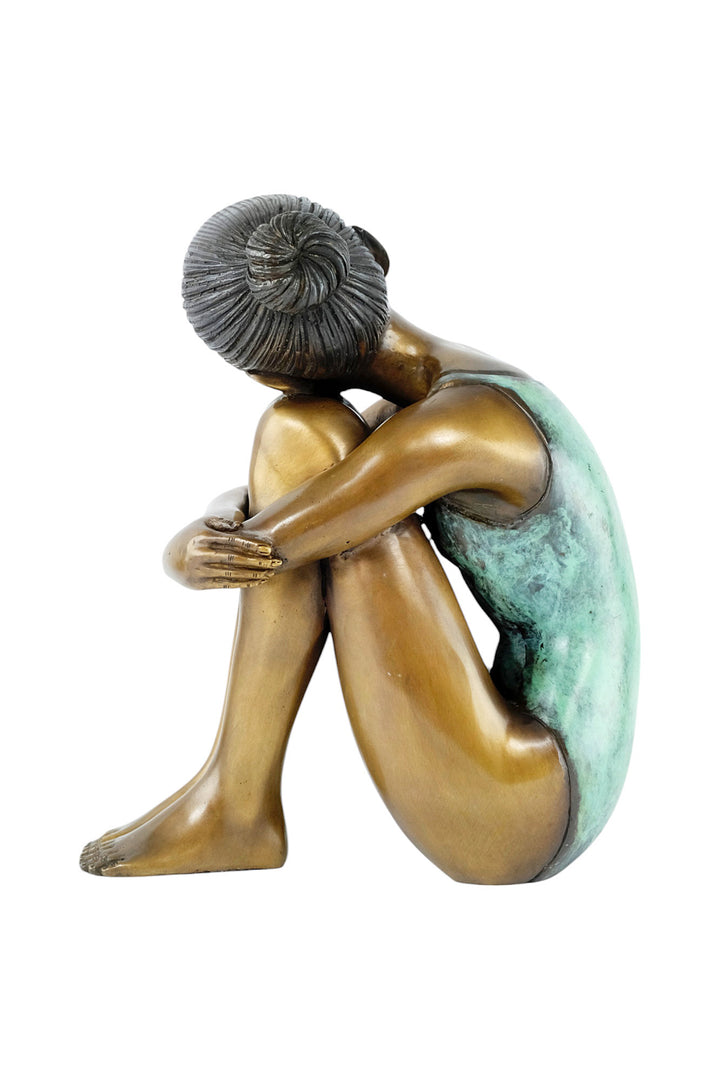 Bronze sculpture of a young girl in swimsuit resting her head