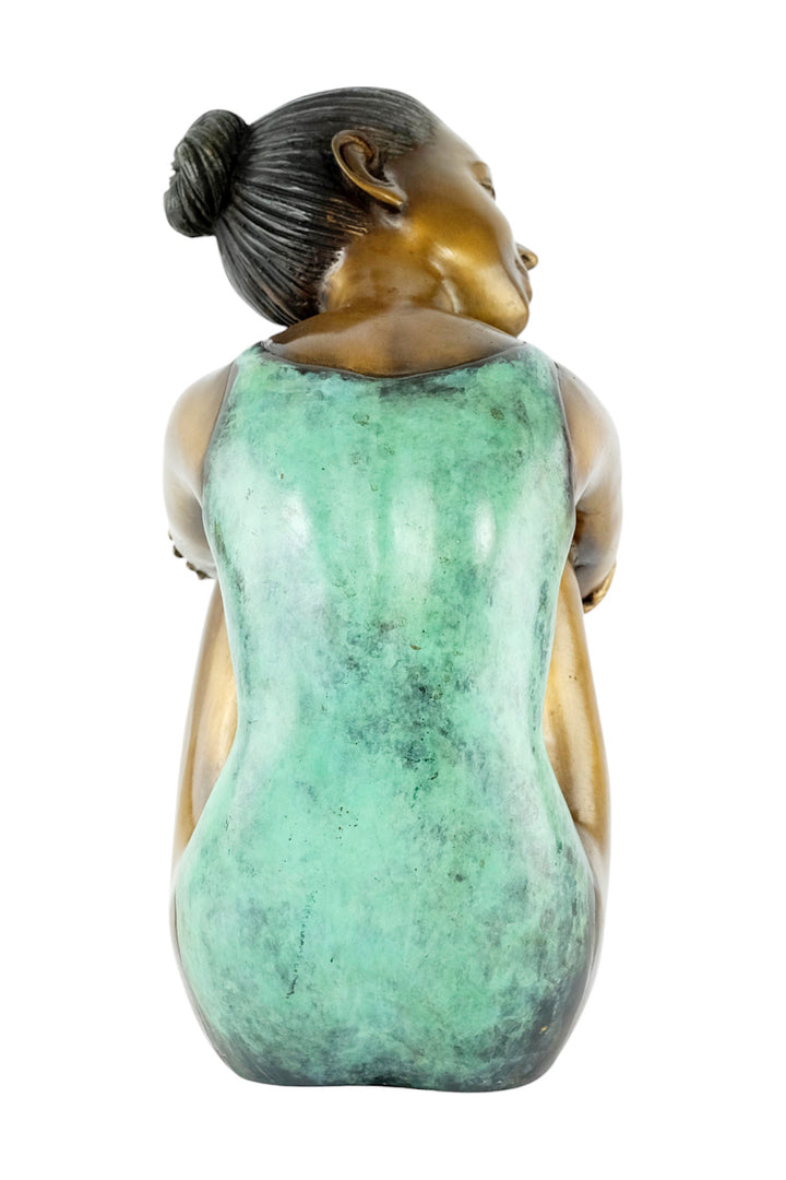 Bronze sculpture of a young girl in swimsuit resting her head
