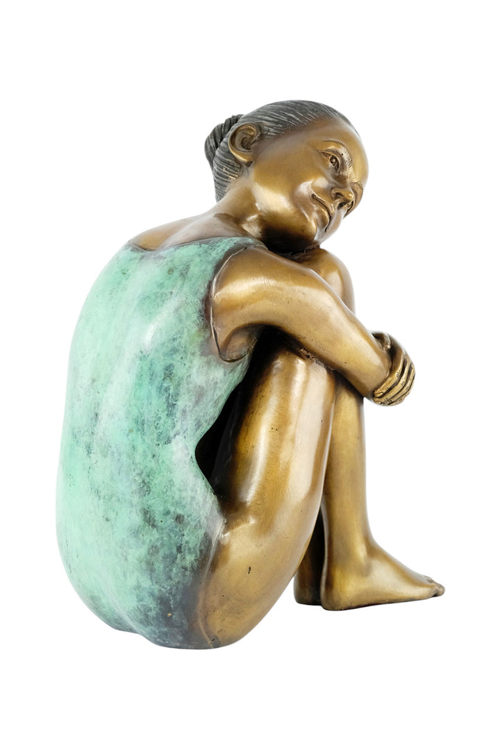 Bronze sculpture of a young girl in swimsuit resting her head