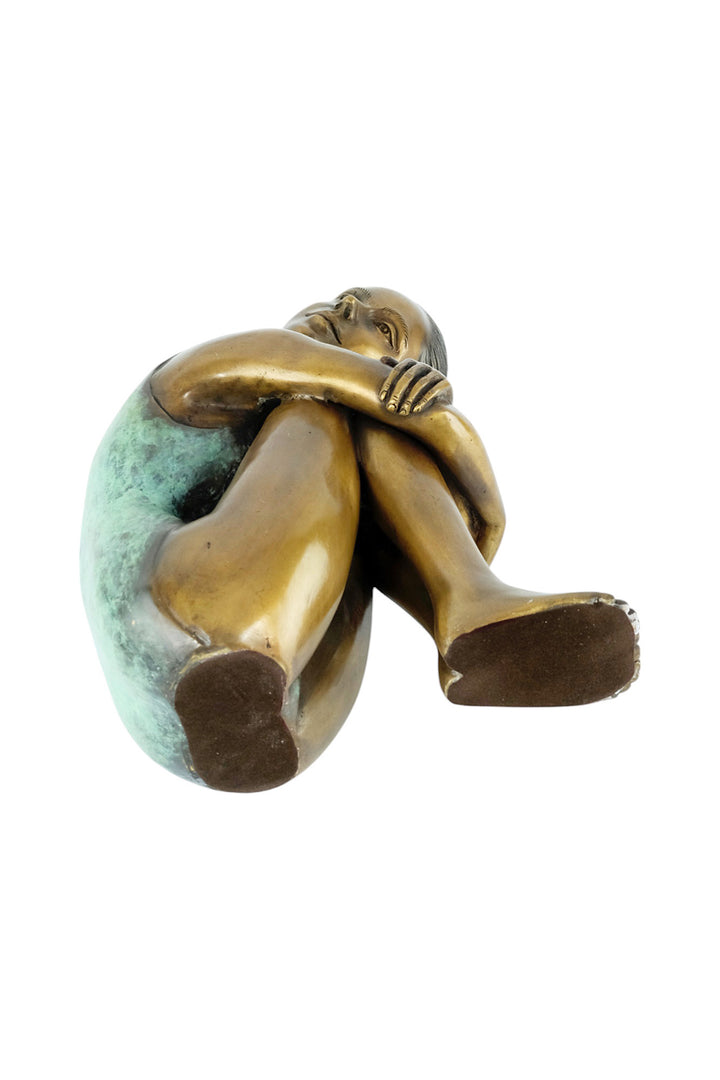 Bronze sculpture of a young girl in swimsuit resting her head